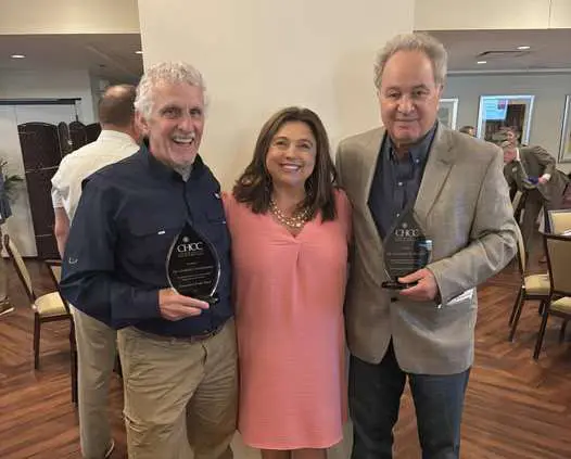Bridget Roop standing with Doctors Pecora and Cunningham